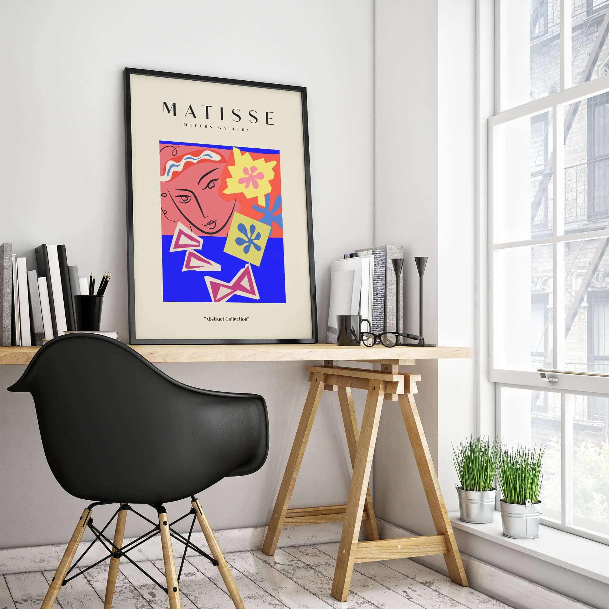 Matisse Art Prints - Abstract Face with Flowers Collage Wall Art displayed in a modern workspace, featuring vibrant colors.