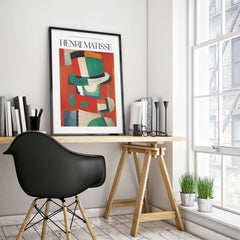 Matisse Art Prints - Abstract Figure with Hat Poster displayed in a modern office setting with a desk and chair.