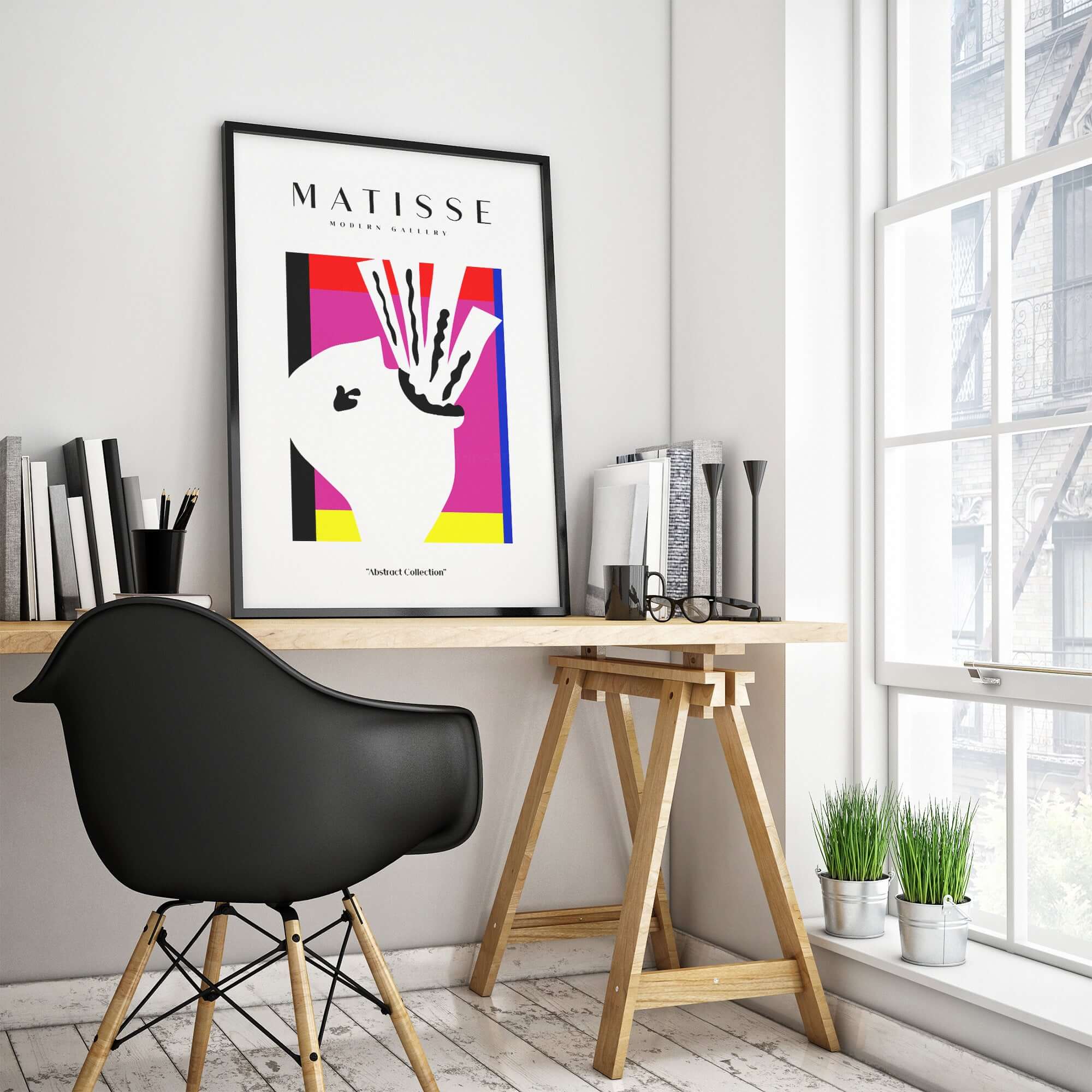 Matisse Art Prints -Abstract Head  Jazz Series Colorful Blocks Wall Art displayed in a modern workspace with books and plants.