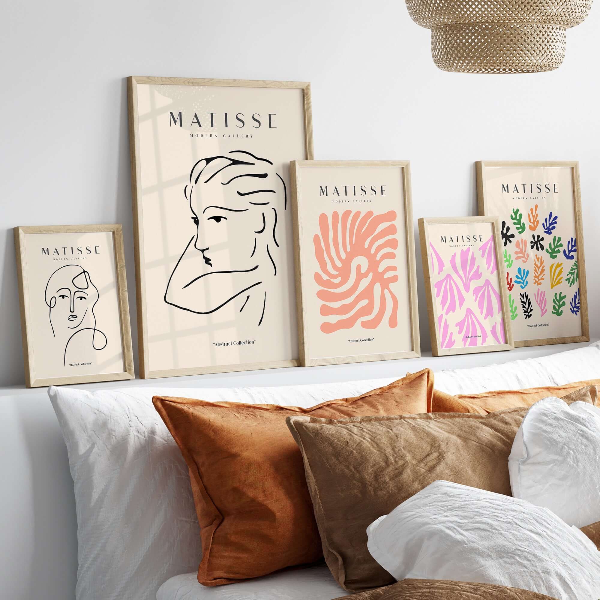 Matisse Art Prints - Abstract Line Drawing of Lady displayed in stylish frames on a shelf above cozy cushions.