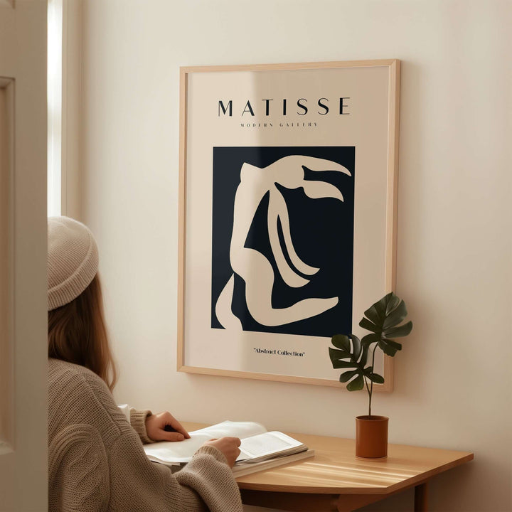 Matisse abstract art print featuring organic figure cut-out in black and beige, displayed in a minimalist setting.