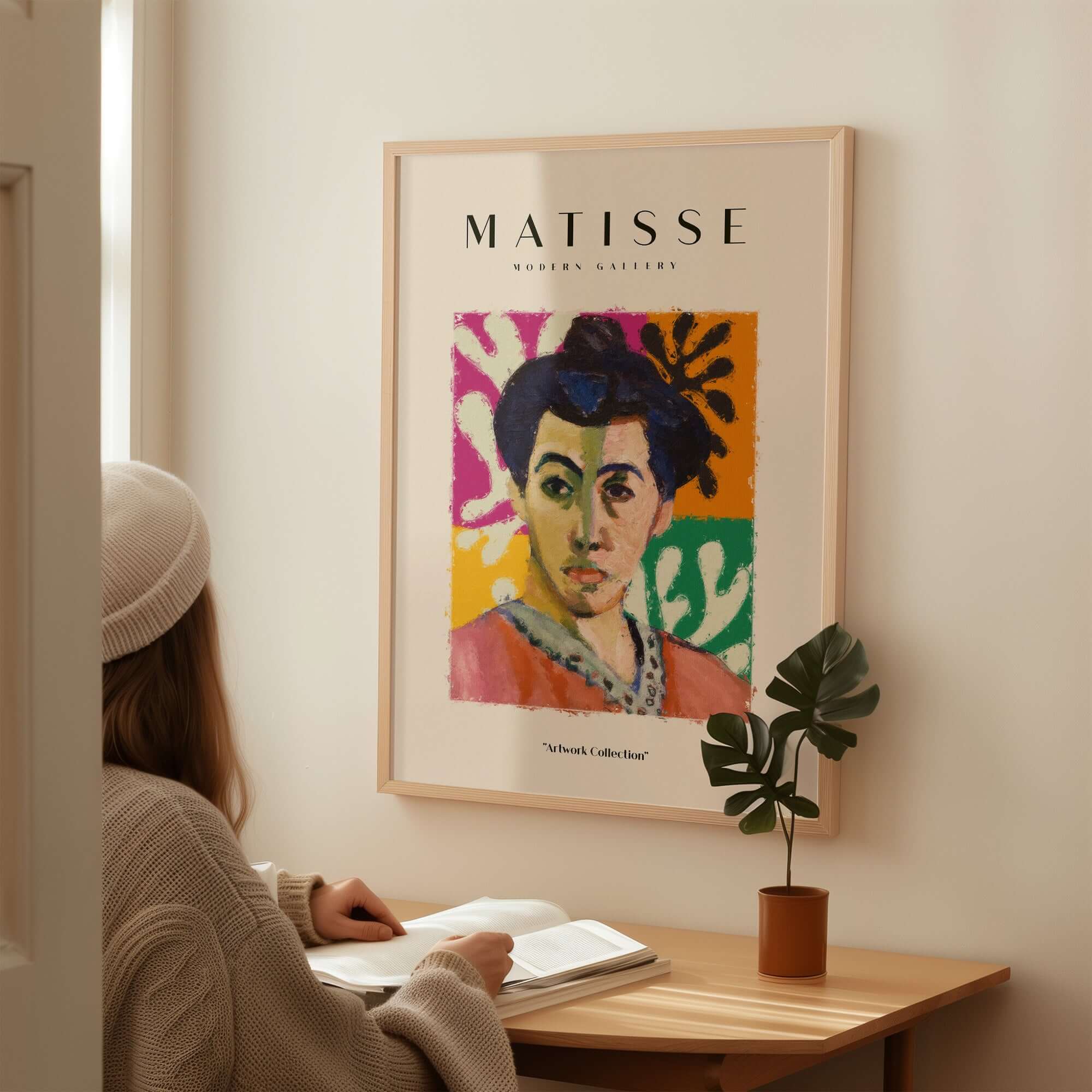 Matisse Art Prints - Abstract Portrait Poster displayed on wall, featuring a colorful portrait of a woman with dark hair.