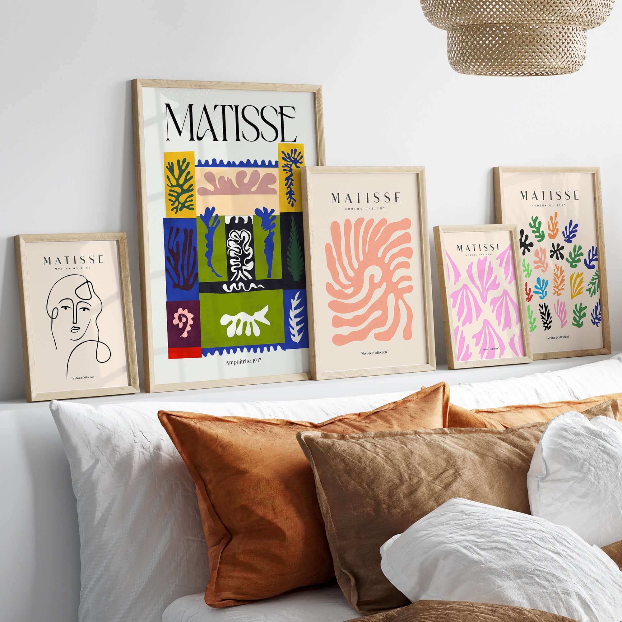 Matisse Amphitrite 1947 Abstract Patchwork Poster Print displayed among other Matisse art prints on a stylish shelf.