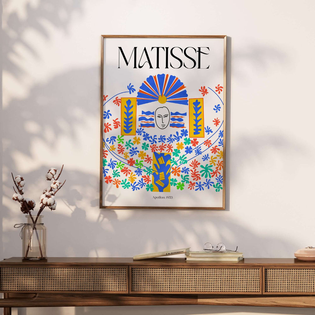 Matisse Apollon 1953 cut-out wall art print featuring colorful floral designs and a central mask on display.