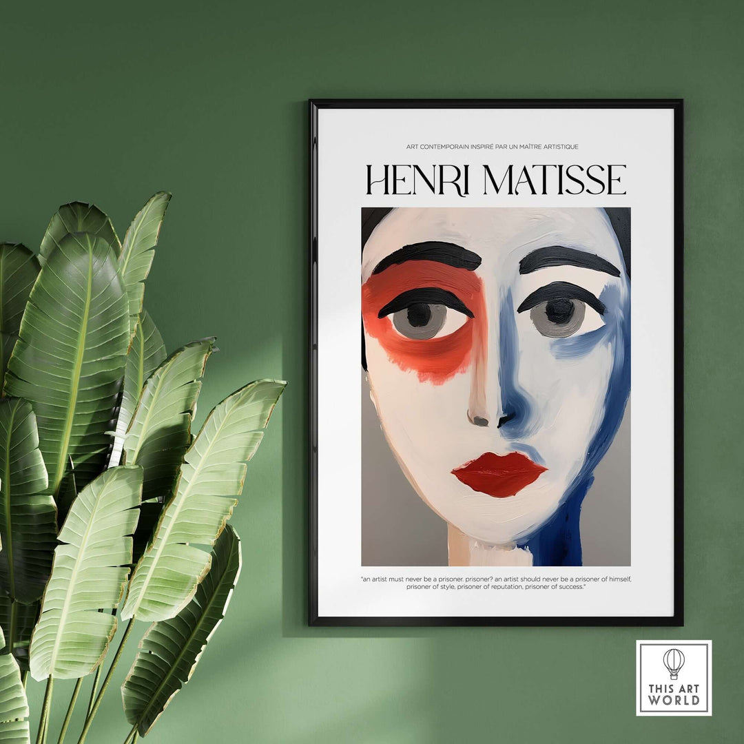 Matisse abstract face portrait print with bold colors displayed on a green wall, surrounded by tropical leaves.