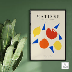 Matisse Art Prints - Abstract Fruit Shapes Blue Triangles Poster displayed in a modern gallery setting with foliage.
