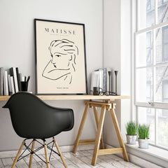 Matisse Art Prints - Abstract Line Drawing of Lady displayed in a modern workspace with natural light and minimal decor.
