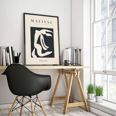 Matisse Art Prints - Abstract Organic Figure Cut Out Print showcased in a stylish home office with a black chair.
