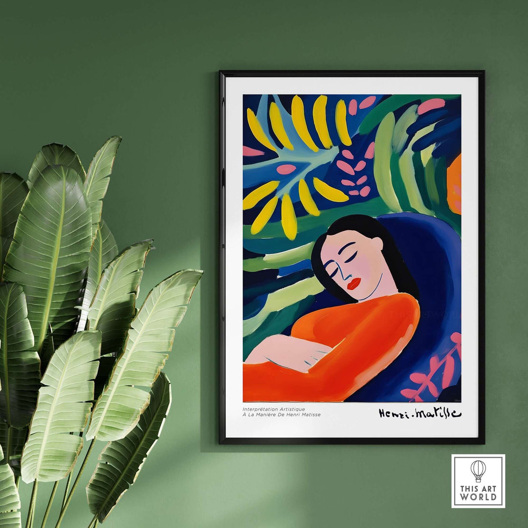Matisse-inspired art print depicting an abstract woman in vibrant colors and lush foliage, framed and displayed against a green wall.