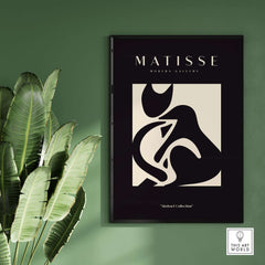Matisse Art Prints - Black Beige Abstract Composition Poster displayed on green wall with plant backdrop.
