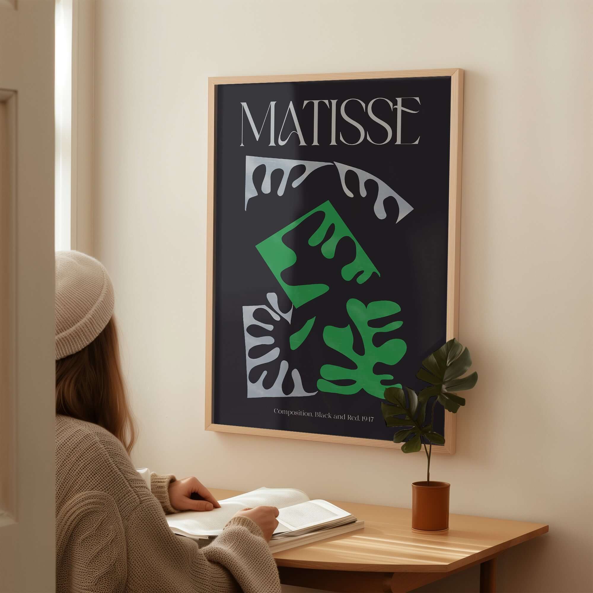Matisse Art Print Composition Black Green White Abstract Poster 1947 displayed in a modern space with a woman studying.