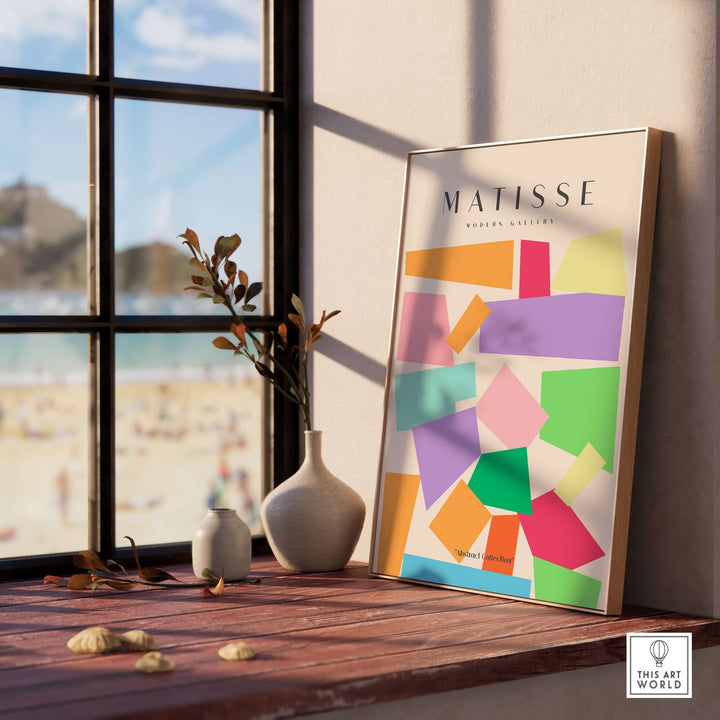 Matisse art print featuring colorful geometric shapes in a modern interior setting with a beachfront view.