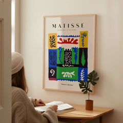 Matisse Art Prints -  Complex Abstract Botanical Patchwork Poster displayed on a wall with a person studying.