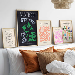 Matisse Art Print Composition Black Green White Abstract Poster 1947 displayed on a modern shelf with decorative pillows.
