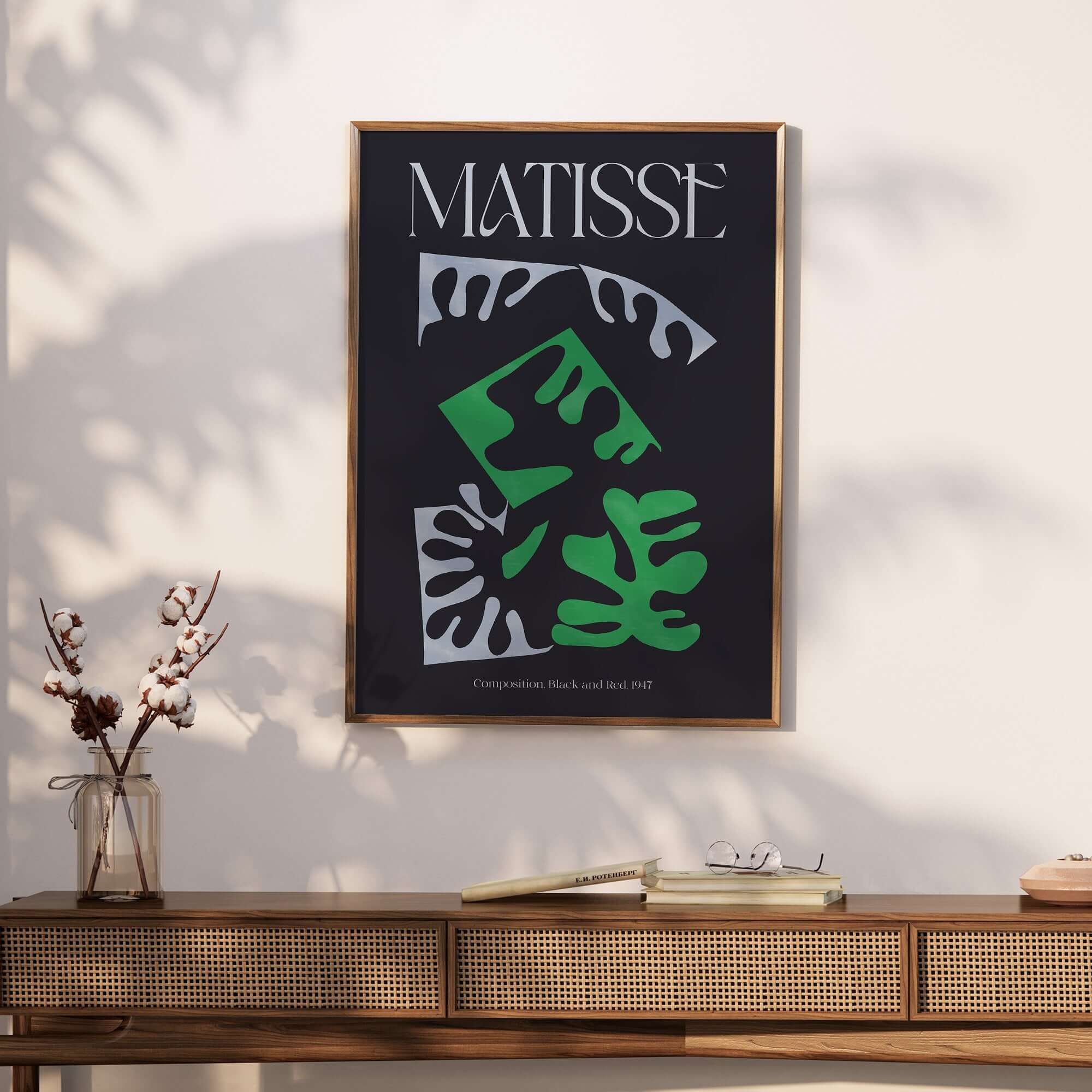 Matisse Art Print Composition Black Green White Abstract Poster 1947 framed on a wall, showcasing bold abstract shapes and colors.