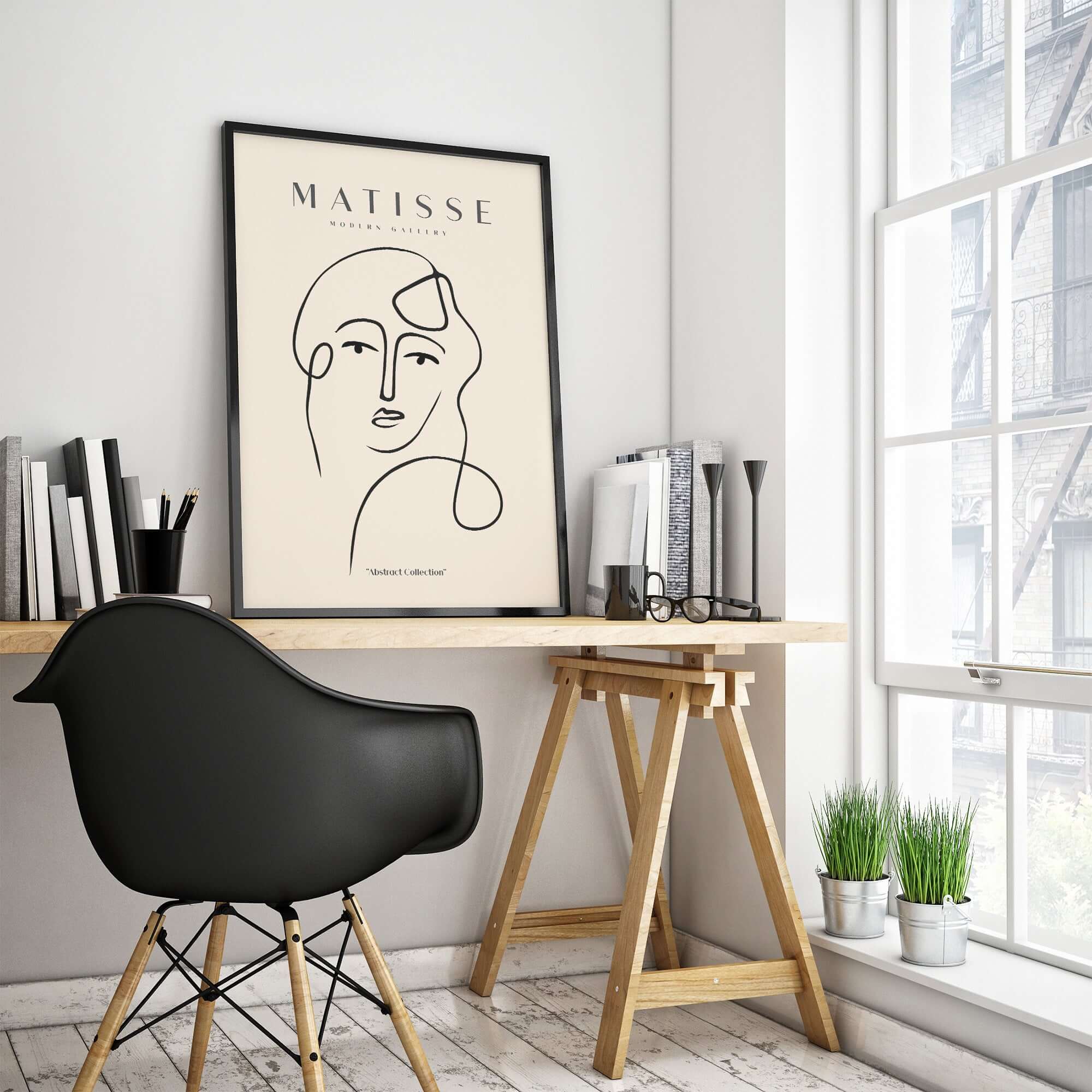 Matisse Art Prints - Continuous Line Abstract Face Poster displayed in a modern workspace with a stylish chair and decor.