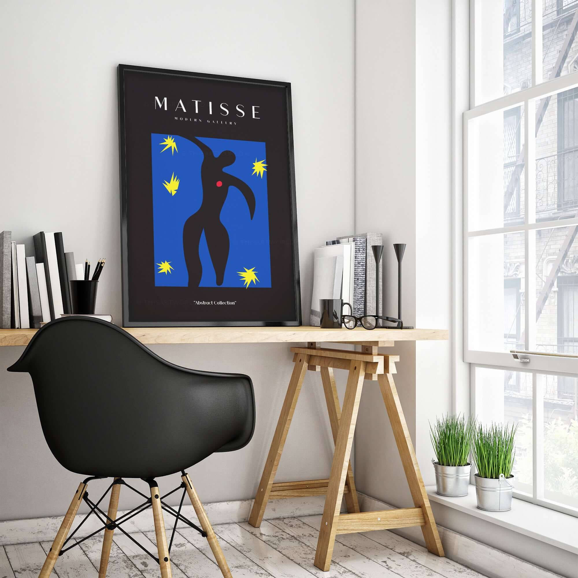 Matisse Art Prints - Icarus Black Figure with Stars Poster displayed in a modern workspace, featuring vibrant colors and artistic design.