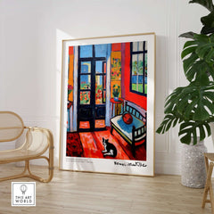Matisse Art Prints - Interior with Cat and Open Door Poster displayed in a bright room with vibrant decor.