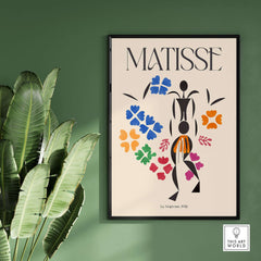 Matisse Art Print - La Négresse 1952 Poster depicting a black abstract figure with colorful floral shapes on a green wall.