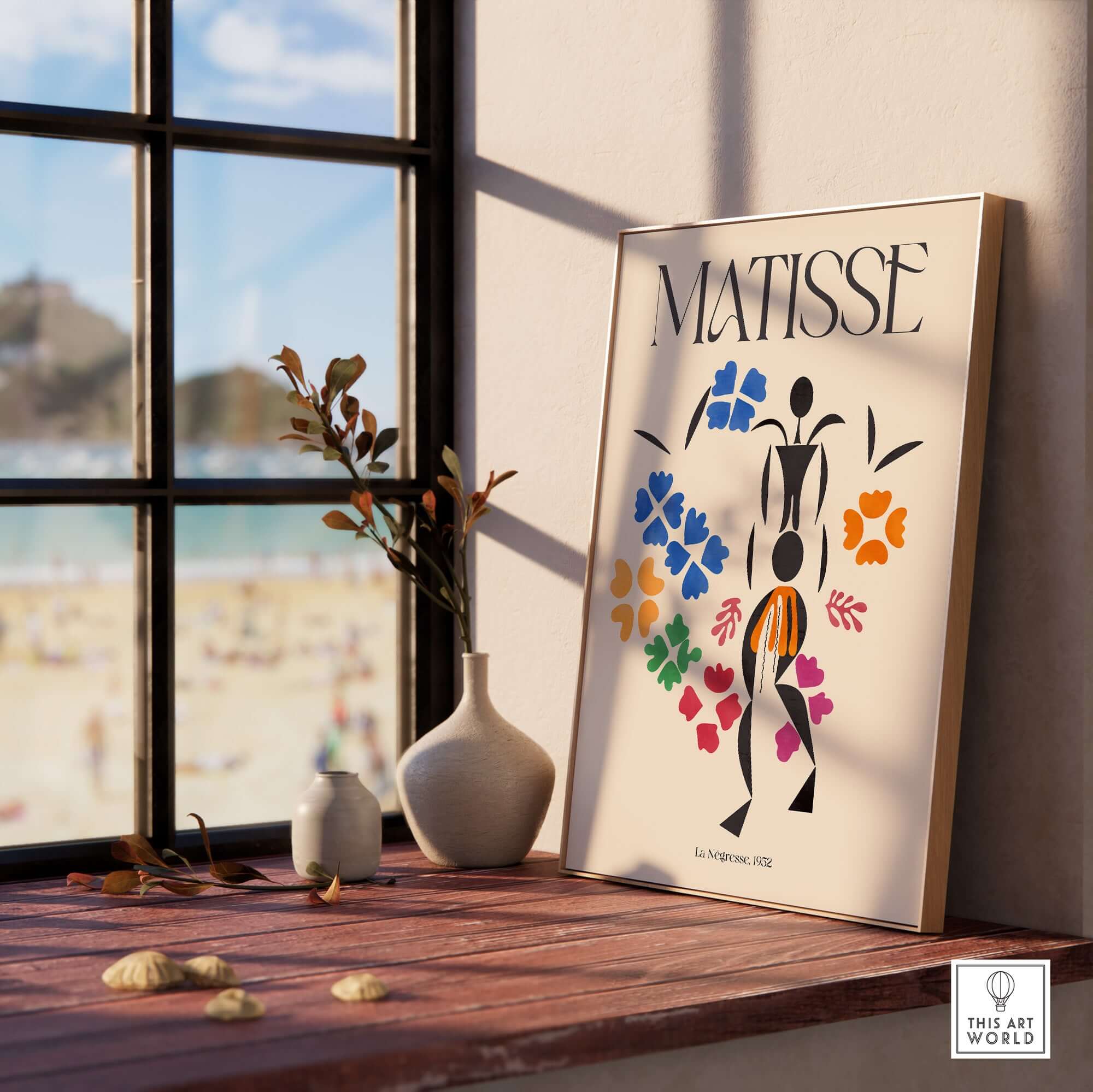 Matisse Art Print - La Négresse 1952 Poster displayed on a wooden shelf with beach view.