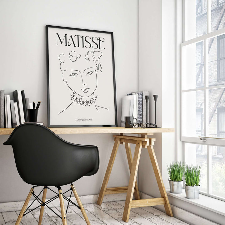 Matisse La Pompadour 1951 minimalist line drawing poster in modern home office with stylish chair and plants.