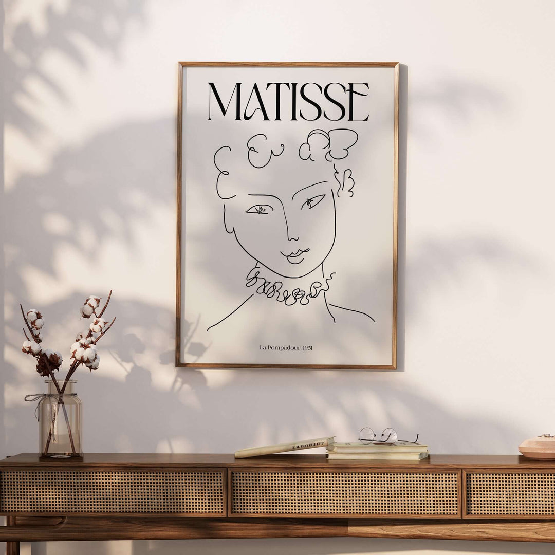 Henri Matisse La Pompadour 1951 minimalist line drawing art print framed on a modern wall.