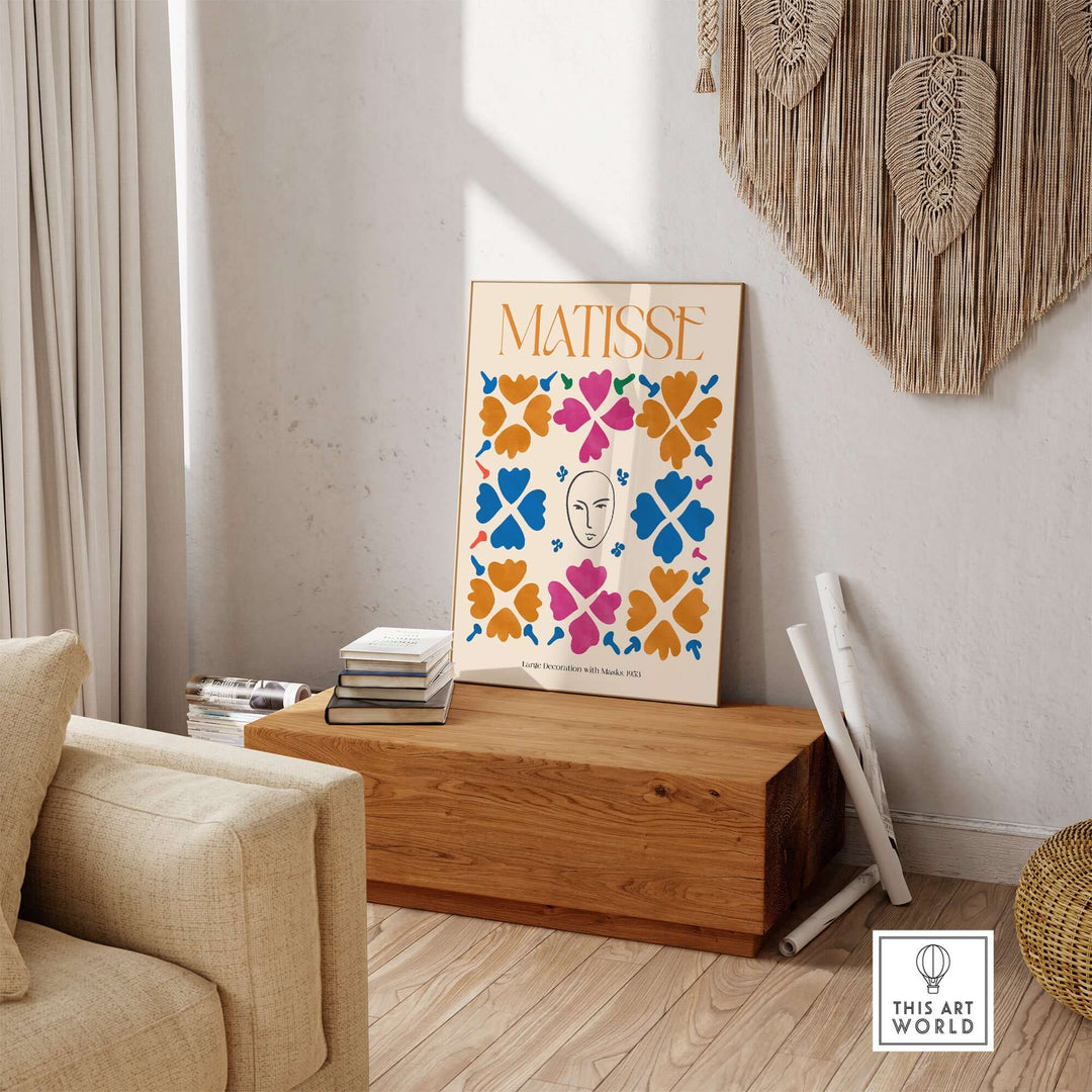 Matisse art print poster featuring masks and floral patterns in vibrant orange, blue, and pink, displayed in a cozy living room.