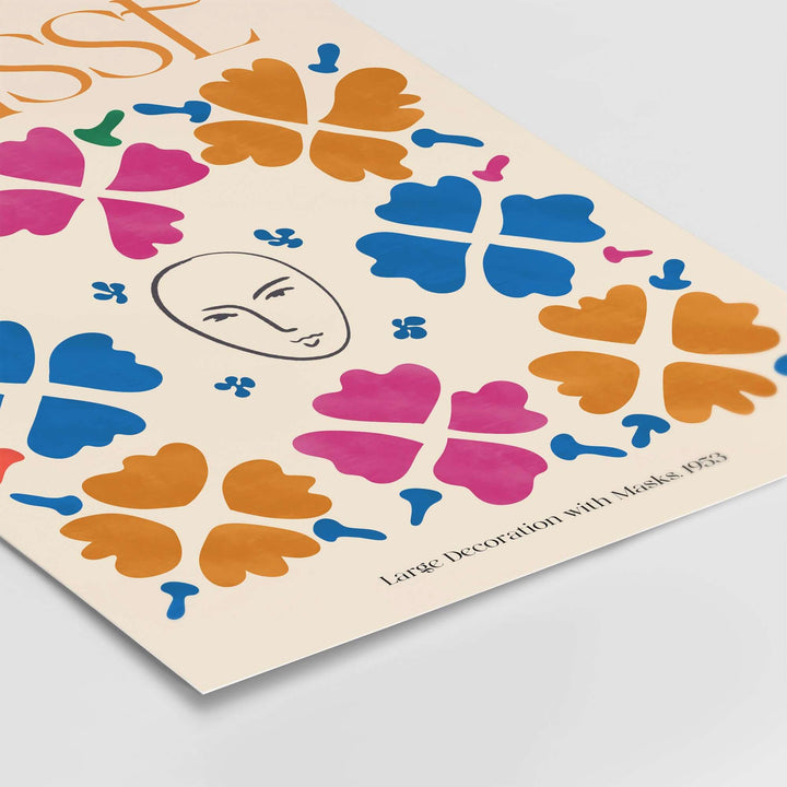 Matisse art print featuring a line-drawn mask surrounded by vibrant floral patterns in orange, blue, and magenta.