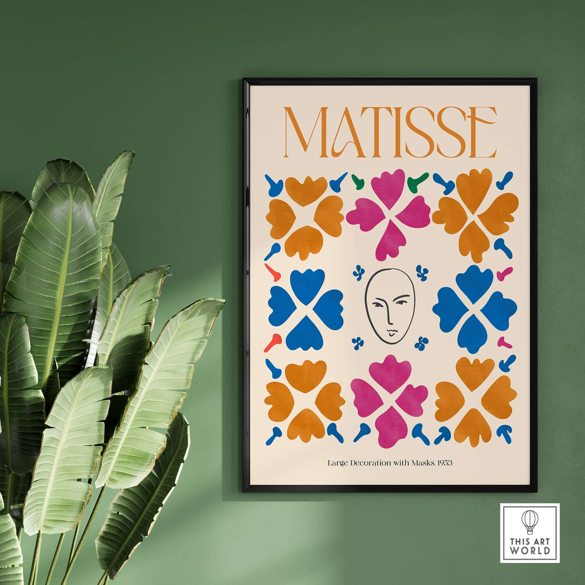 Matisse Art Print - Large Decoration with Masks Floral Pattern Poster displayed on a green wall surrounded by plants.