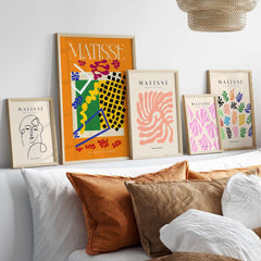 Matisse Art Print - Les Codomas Jazz 1947 Abstract Cut Out Art Poster displayed on wall with decorative pillows.