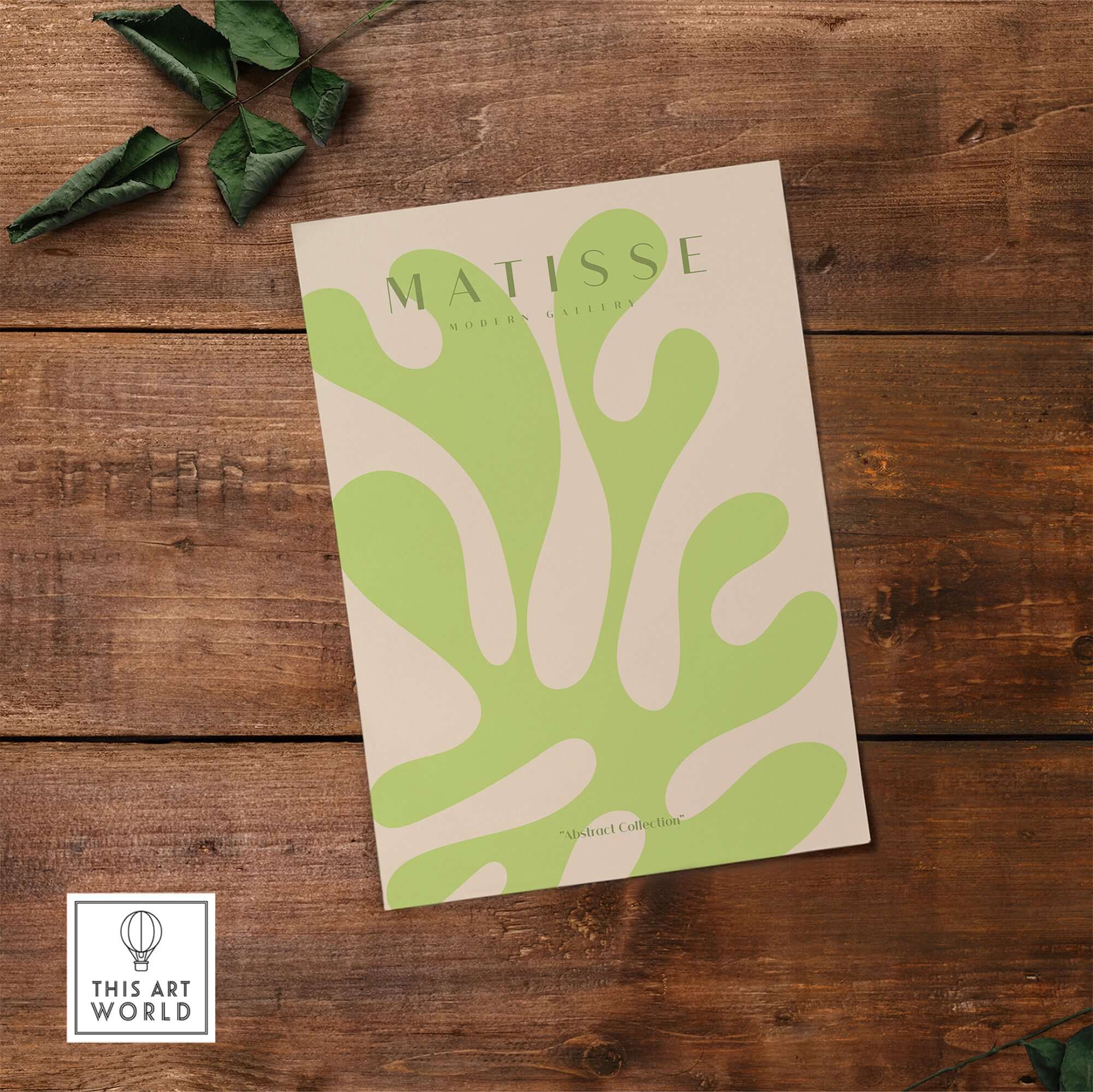 Matisse Art Prints - Lime Green Abstract Coral Shape Poster displayed on wood background with greenery accents.