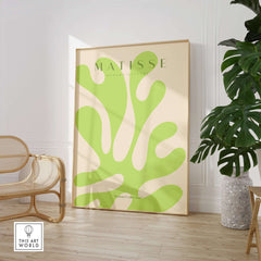 Matisse Art Prints - Lime Green Abstract Coral Shape Poster displayed in a modern interior setting with minimalist furniture.