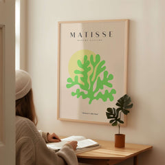 Matisse Art Prints - Lime Green Coral Abstract Sun Print on wall with a woman admiring it.