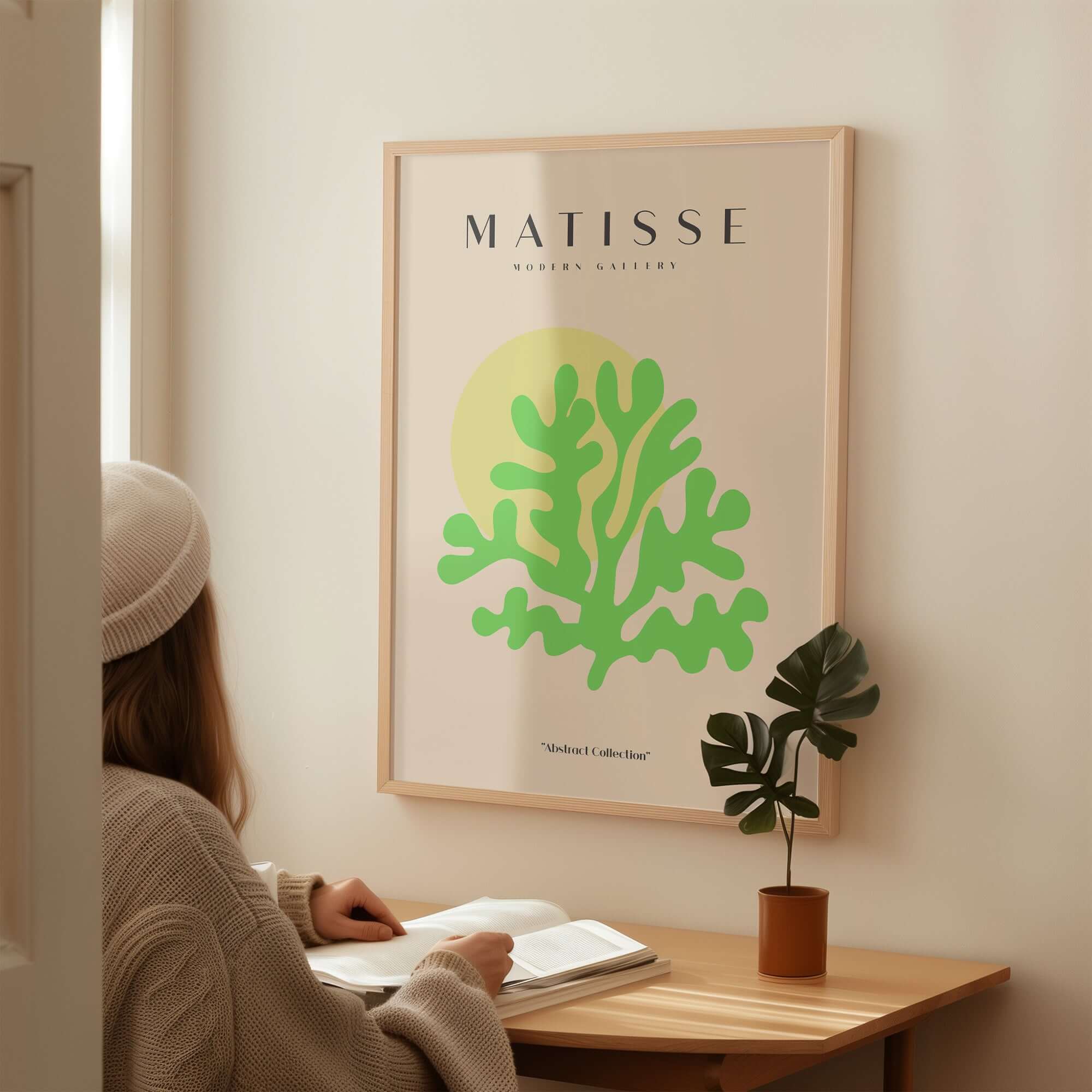 Matisse Art Prints - Lime Green Coral Abstract Sun Print on wall with a woman admiring it.