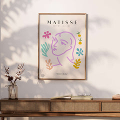 Matisse Art Prints -Line Art Face Abstract Botanical Collage Poster featuring a lavender line drawing on a beige background.