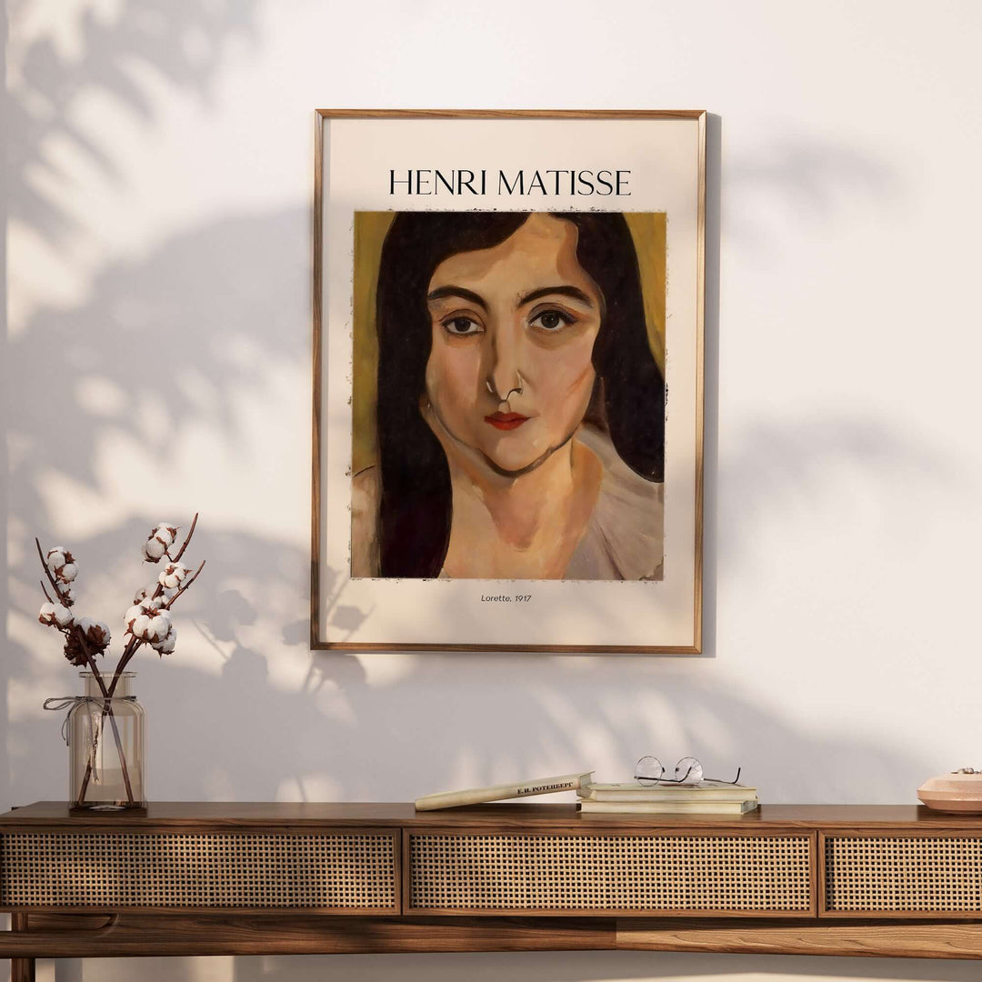 Henri Matisse Lorette 1917 portrait print framed on a wall beside decor items.