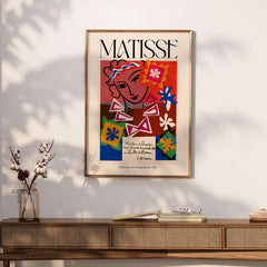 Matisse Art Print Madame de Pompadour 1951 Abstract Collage Poster displayed on a stylish wooden table.