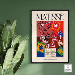 Matisse Art Print Madame de Pompadour 1951 Abstract Collage Poster displayed on a green wall with plants.