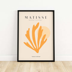 Matisse Art Prints - Orange Seaweed Abstract Art Print in a modern frame against a beige wall showcasing coastal abstraction.