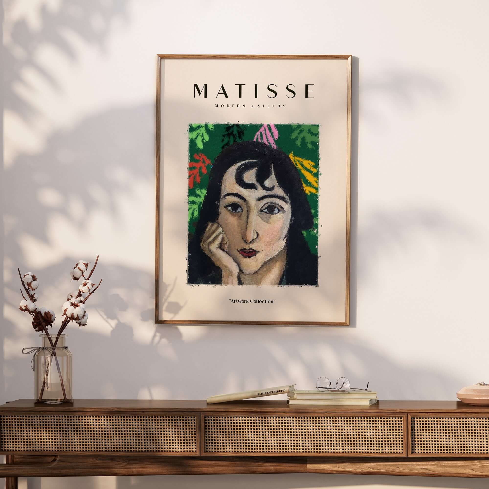 Matisse Art Prints - Pensive Woman Poster displayed on a wall above a wooden table with flowers.