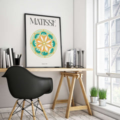 Matisse Art Print Rosace 1954 Rose Window Geometric Art Print framed on a wall above a modern work desk.