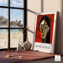 Matisse Art Prints - Stylized Woman Portrait Red Wall Art displayed on a windowsill with decorative vases.