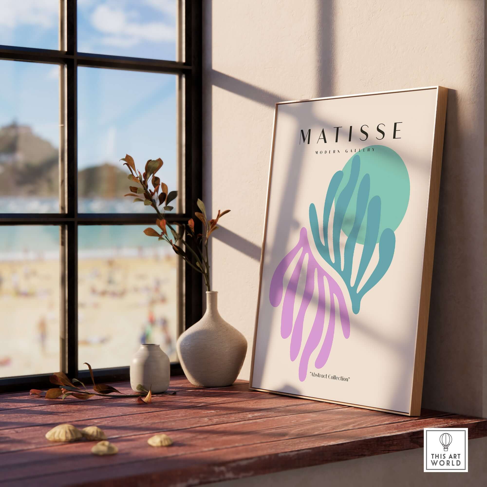 Matisse Art Prints -Teal Pink Abstract Leaves Sun Poster displayed in a bright, modern interior by a window overlooking a beach.