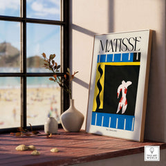 Matisse Art Print - The Clown 1943 Jazz Series Abstract Figure Poster displayed in a sunlit room with a beach view.