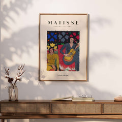 Matisse Art Prints - Two Women Guitar Interior Scene Poster displayed on a wall in a stylish interior.