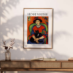 Matisse Art Prints - Woman with Black Cat Interior Poster featuring a woman with a black cat in a colorful room.