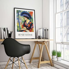 Matisse Art Prints - Woman with Blue Hat Garden Poster displayed in a stylish modern workspace.