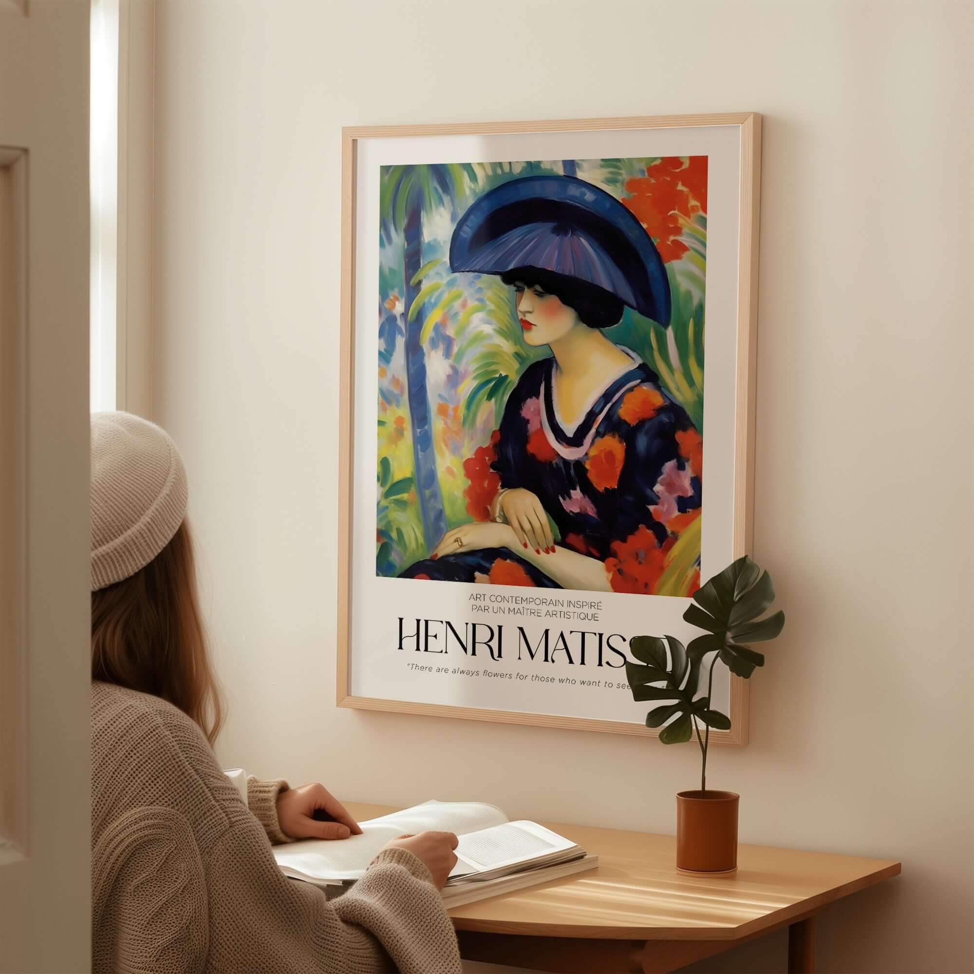 Matisse Art Prints - Woman with Blue Hat Garden Poster displayed in a cozy interior, featuring vibrant colors and modern decor.