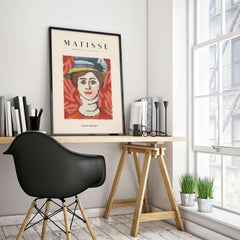 Matisse Art Prints - Woman in Elaborate Hat Portrait Poster displayed in a stylish workspace.