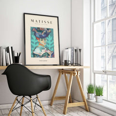 Matisse Art Prints - Woman Large Hat Portrait Teal Background Poster displayed in a modern interior setting.